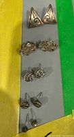 All five pairs of silver-tone stud earrings in one shot