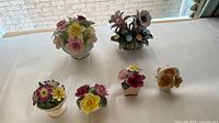 Group shot of all five floral figurines