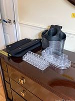 Full set on dresser: neoprene pouch, Polder caddy, two acrylic organizers