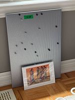 Pegboard with magnetic pins and one matted print front view