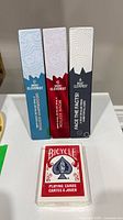 Front view of boxed Mount Cleverest games and sealed Bicycle deck