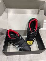 Pair of Peloton cycling shoes in original box, top view