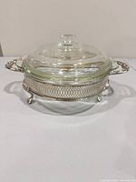 Complete assembled serving dish showing silver stand, glass bowl, glass lid