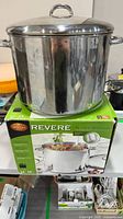 Revere Ware 16 qt stock pot with lid atop vase box