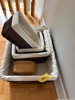 Nested rectangular baskets with liners and small tan basket inside