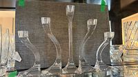 Front view showing all five clear crystal candlestick holders
