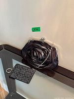 Clutch and Coach card case together for scale and overview