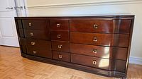 Full front view showing nine drawers and overall design