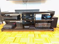 Front view showing three glass shelves and cable ports