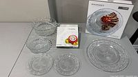 All serveware including boxed platter, boxed plate set, loose plates and bowls