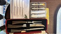 Full lot showing carving set in case, additional spreaders in packaging