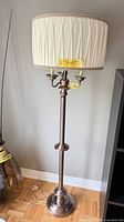 Full view of bronze floor lamp with shade