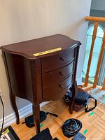 Full view of mahogany side table front and legs
