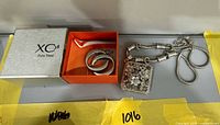 Full set: XC38 box, interior tray with earrings, necklace laid out