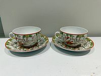 Front view of both cups on saucers