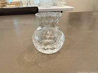 Front view of crystal bud vase showing Made in England etching and cut pattern