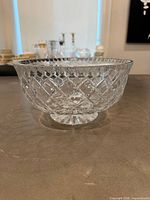 Side view of crystal bowl showing diamond cut pattern and pedestal foot