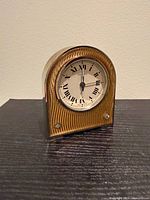 Front view of Cartier guilloche enamel desk clock showing dial and case