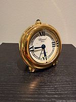 Front view of Chopard Happy Day desk clock displaying dial, hands and overall face condition