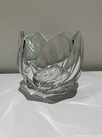 Front view of heavy clear crystal bowl showing swirl cut design and scalloped rim