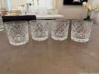 Four Cartier cut crystal whiskey glasses front view