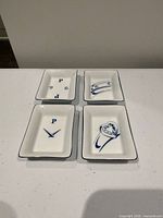 All four dishes top view showing unique blue designs and rim edging