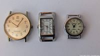 Three watch heads side by side