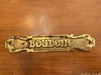 Front view of the cast brass "BOUDOIR" sign