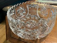 Oblique view of cut crystal bowl showing pinwheel pattern and sawtooth rim
