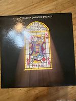 Front album cover showing stained-glass artwork