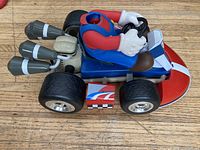 Side view of Mario Kart vehicle showing missing head and rear boosters