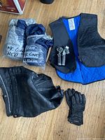All items overview: chaps, gloves, foot pegs, two covers, cooling vest