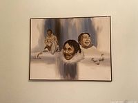 Full view of framed oil painting showing Inuit figures and seals