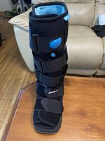 Full view of Ossur Formfit Air Walker Boot showing height, straps, and air pump button