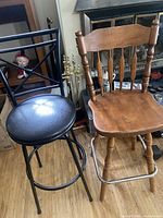 Wood and metal swivel bar stools side by side
