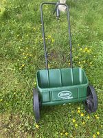 Front view of Scotts AccuGreen 1000 drop spreader on lawn