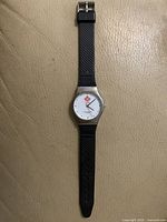 Front view of watch showing dial, strap and buckle