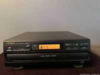 Front angled view of Citizen 5-disc CD changer showing display and controls