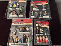 All four sealed Lemax Village Collection blister packs