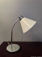 Side view showing base, stem, gooseneck and shade