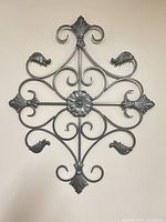 Full view of wrought iron wall art showing shape and design