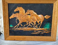 Front view showing full copper horse relief and wooden frame
