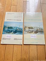 Two folded chart covers showing titles and artwork
