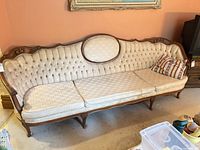Full view of sofa front showing design and upholstery