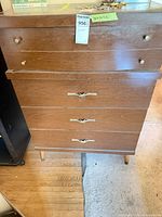 Front view showing entire dresser, four drawers, hardware, legs
