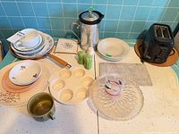 Overall view of dinnerware, appliances and accessories
