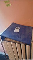 closed blue binder with label visible