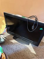 Front view of Sony 32-inch TV with power cord