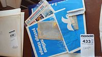 Group of envelopes and glassine packets containing stamp sheets