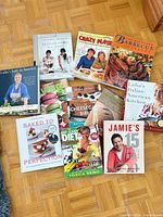 All 11 cookbooks and magazines laid out on floor